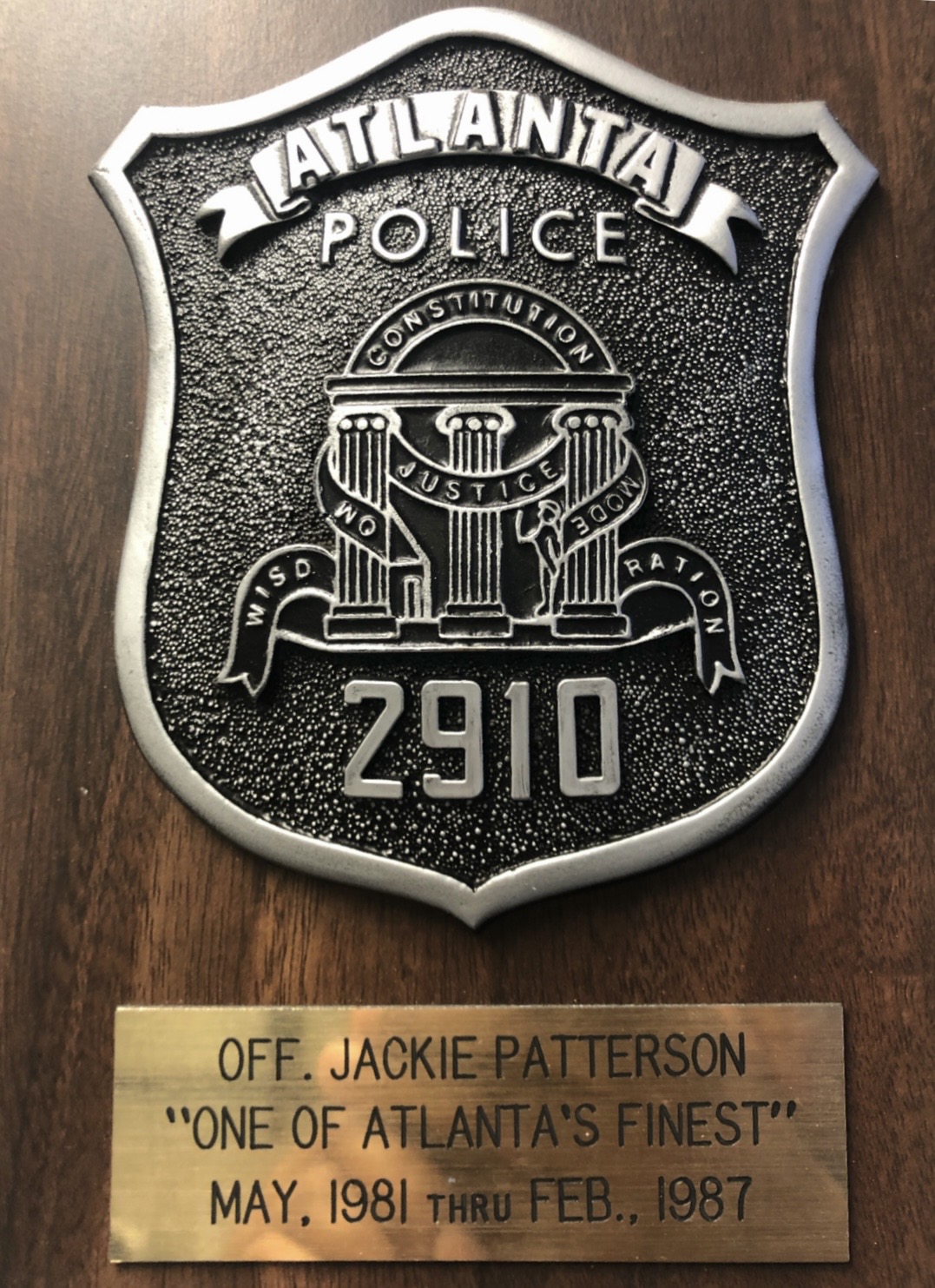 Atlanta Police badge plaque #2910 honoring Officer Jackie Patterson, 1981–1987